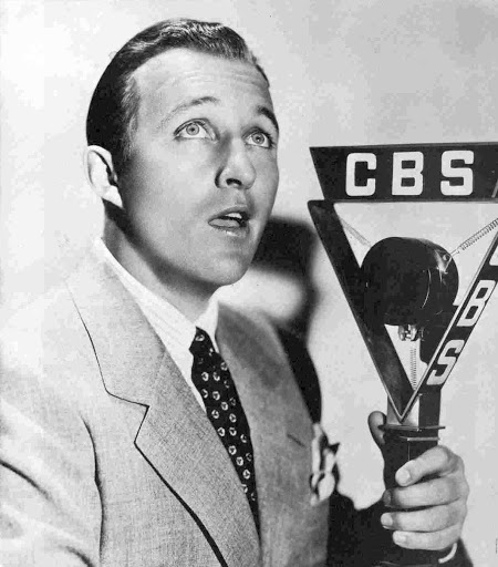 Photo of Bing Crosby performing on a CBS radio microphone