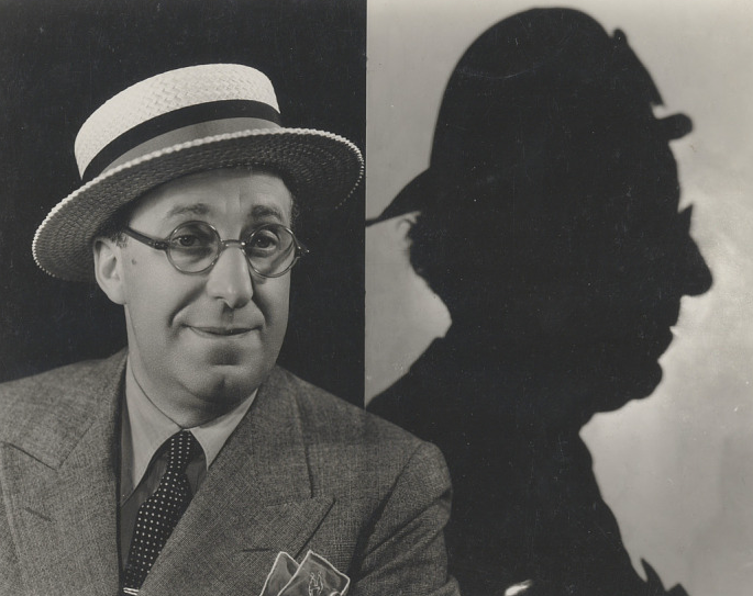 Photo of radio comedian Ed Wynn alongside a shadow that looks like his The Fire Chief character
