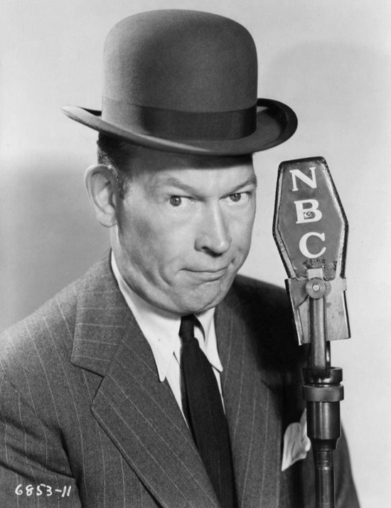 Publicity photo of Texaco Star Theater radio host Fred Allen at an NBC microphone