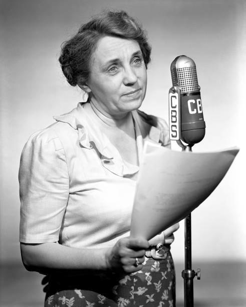 Tess Sheehan at a CBS radio microphone